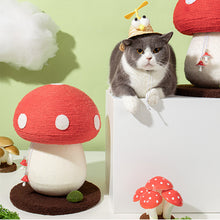 Load image into Gallery viewer, A cat sitting next to the Mushroom Cat Scratcher, showcasing its compact size and playful design.